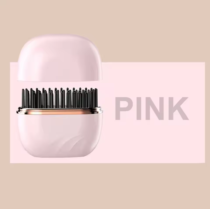 Pink hairbrush with black bristles on a beige background